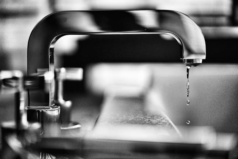 Water dripping from a chrome tap